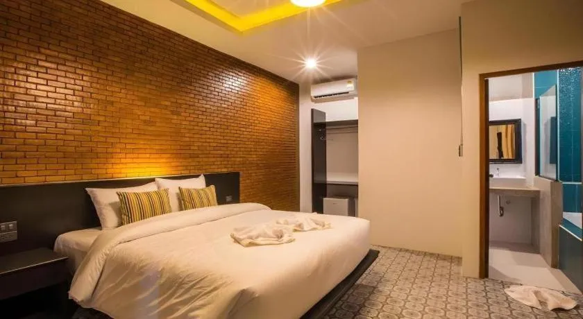 Bed in M Boutique Resort