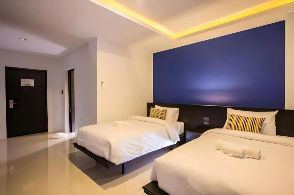 Bed in M Boutique Resort