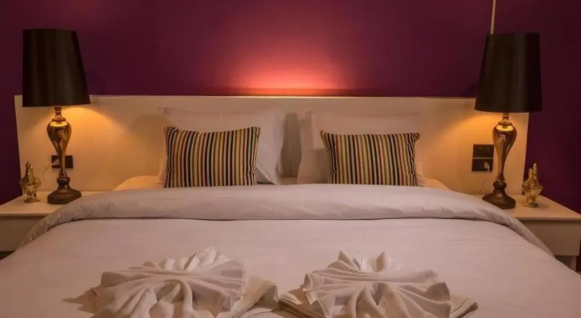 Bed in M Boutique Resort