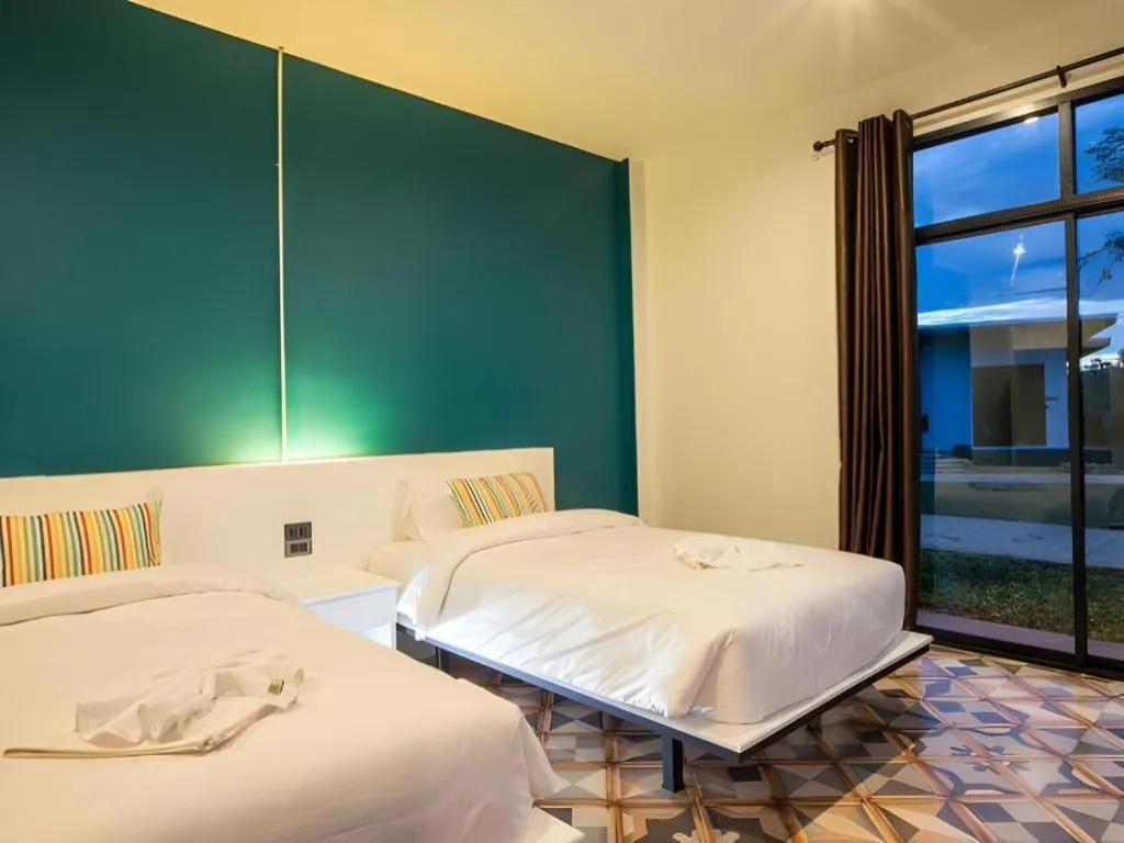 Bed in M Boutique Resort