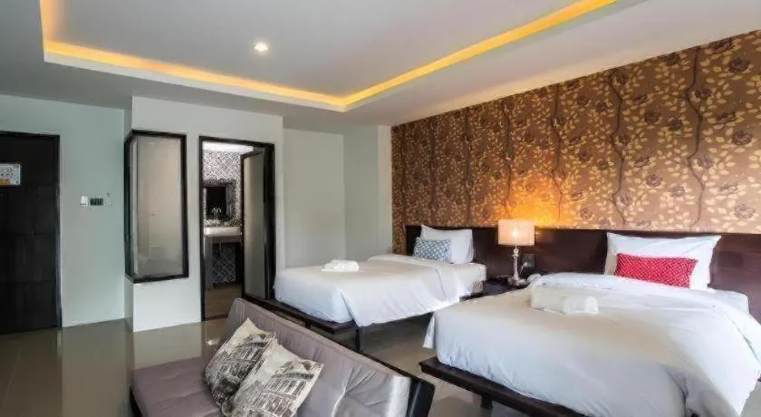 Bed in M Boutique Resort