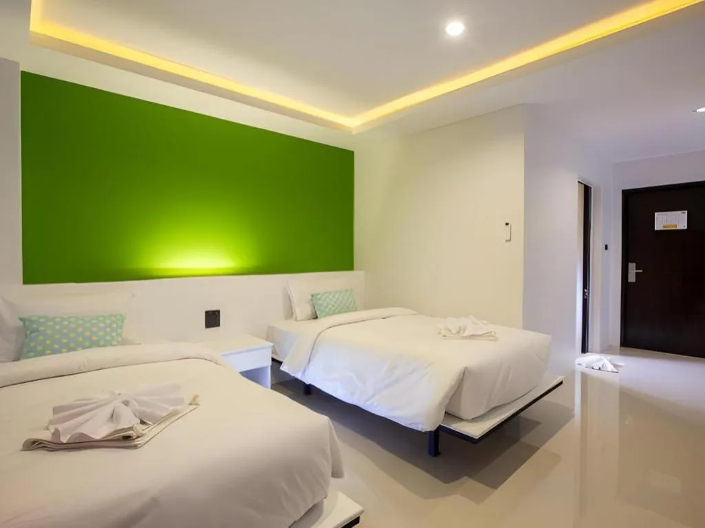 Bed in M Boutique Resort