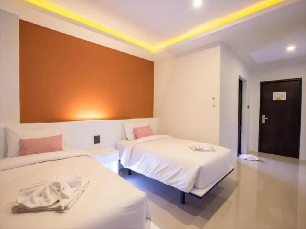 Bed in M Boutique Resort