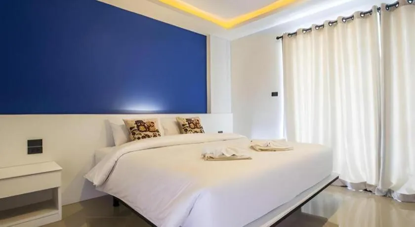 Bed in M Boutique Resort