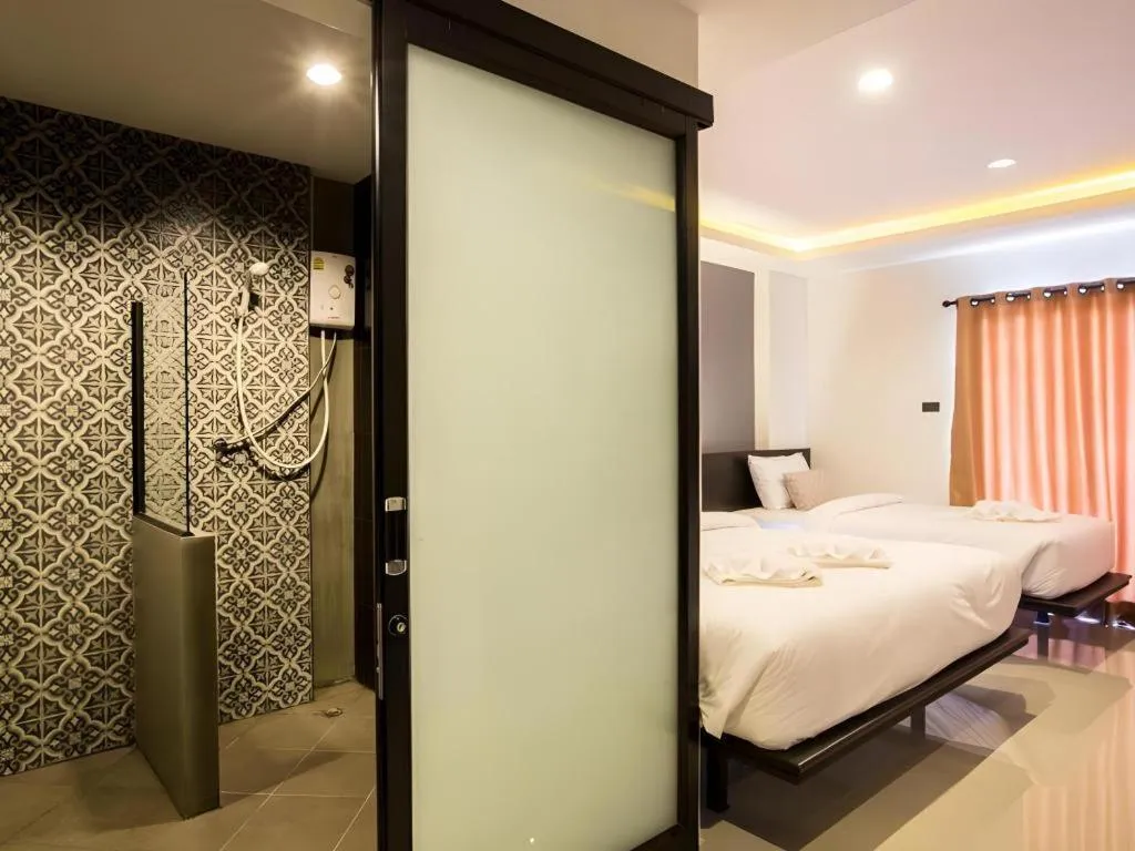 Bed in M Boutique Resort