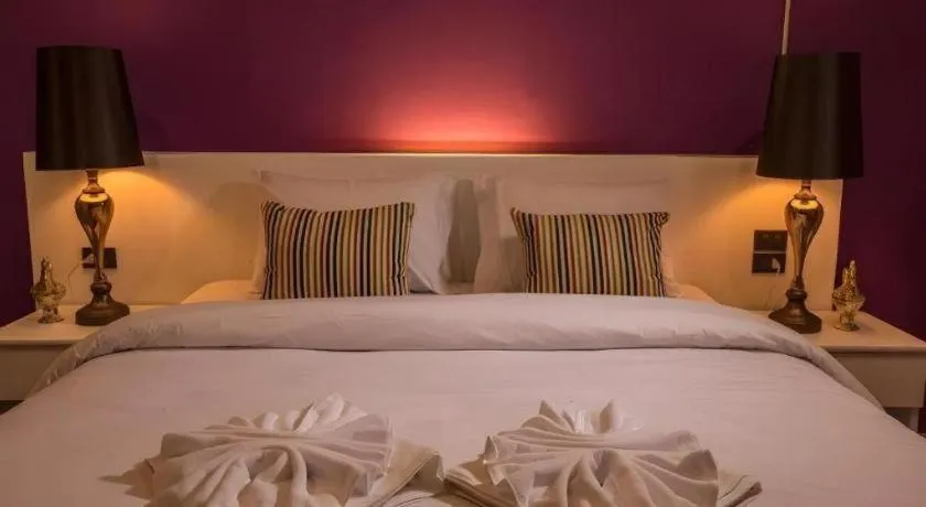Bed in M Boutique Resort