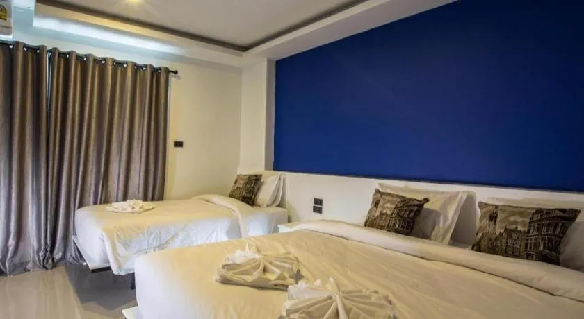 Bed in M Boutique Resort