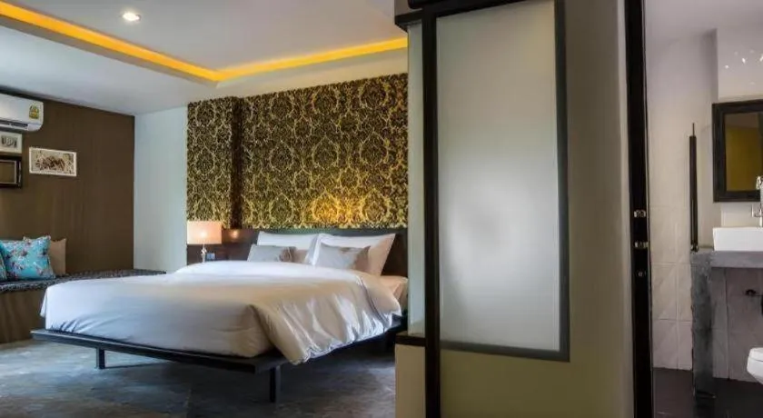 Bed in M Boutique Resort