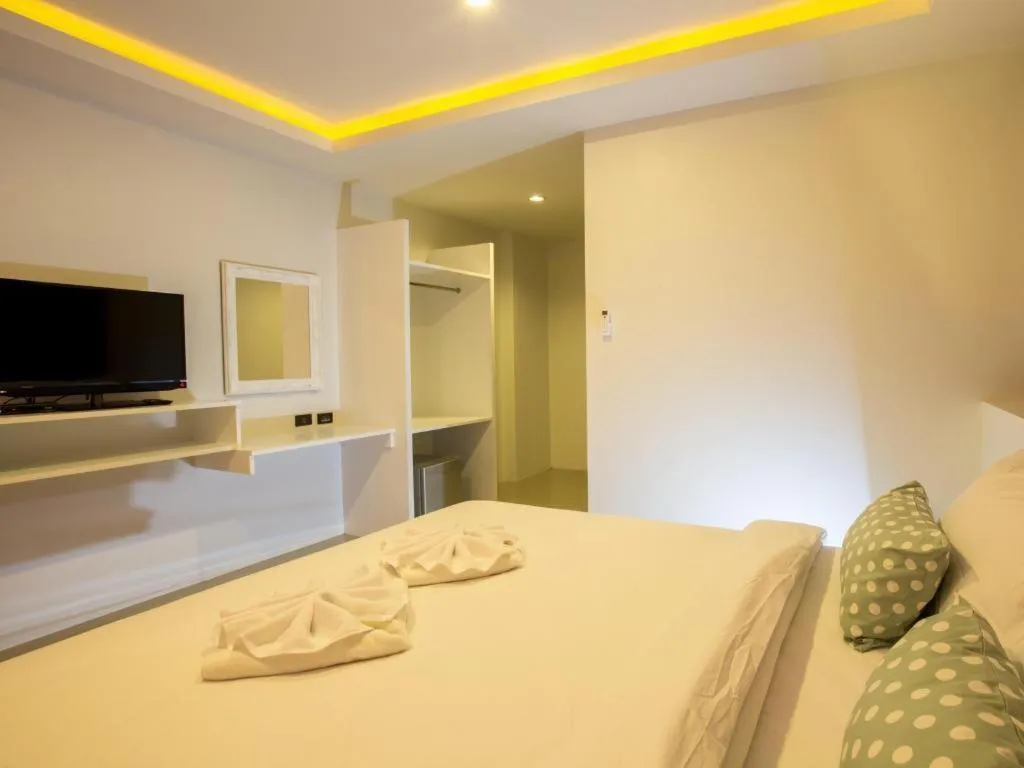 Bed in M Boutique Resort