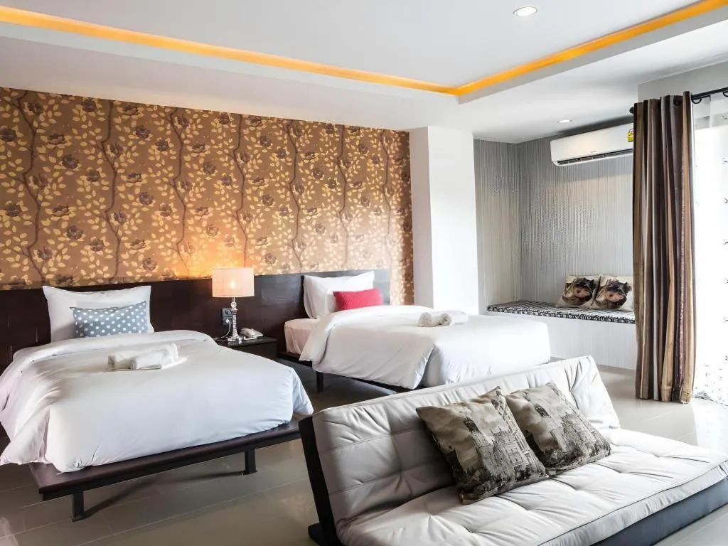 Bed in M Boutique Resort