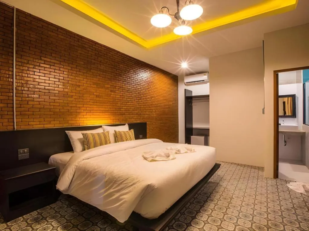 Bed in M Boutique Resort