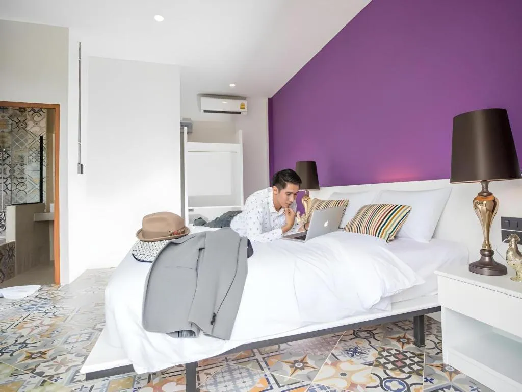 Bed in M Boutique Resort