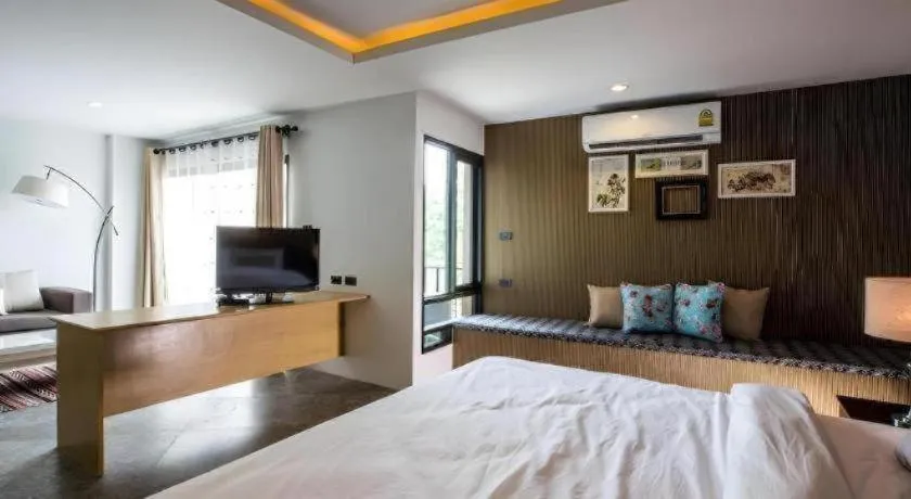 Bed in M Boutique Resort