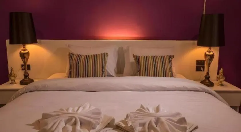 Bed in M Boutique Resort