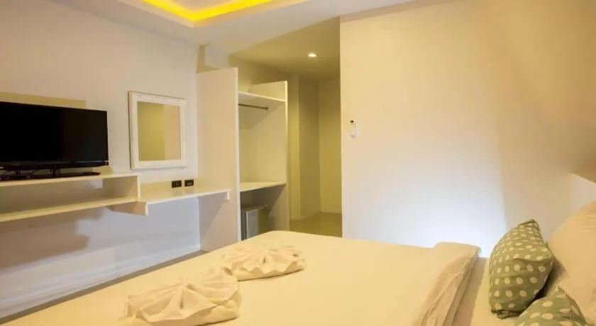 Bed in M Boutique Resort