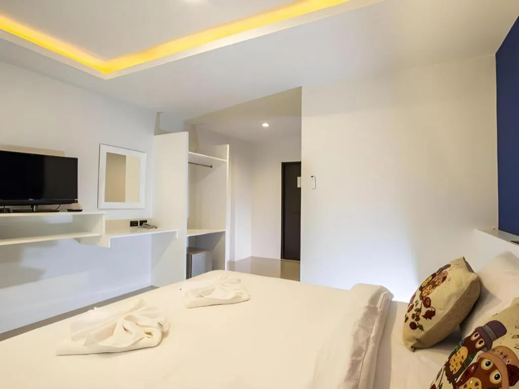 Bed in M Boutique Resort