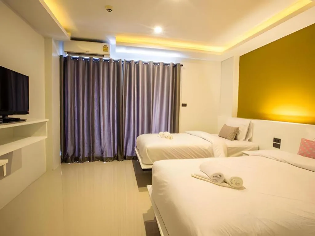 Bed in M Boutique Resort