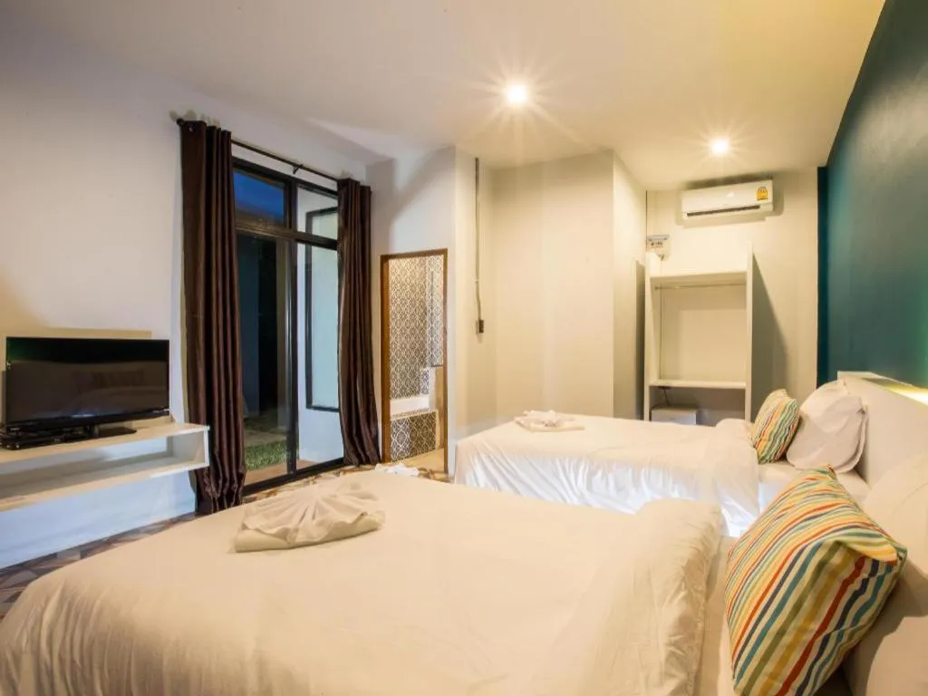 Bed in M Boutique Resort