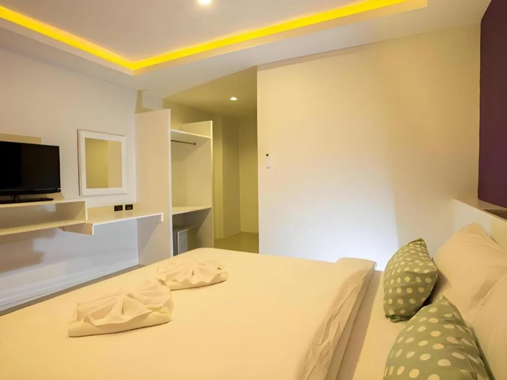 Bed in M Boutique Resort