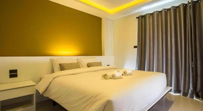 Bed in M Boutique Resort