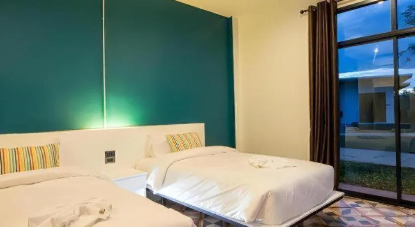 Bed in M Boutique Resort