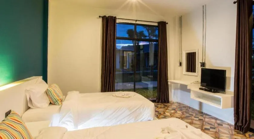 Bed in M Boutique Resort