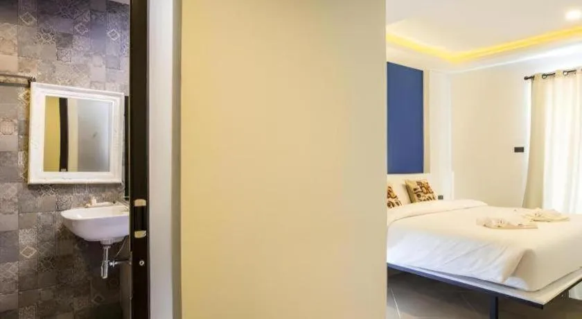 Bed in M Boutique Resort