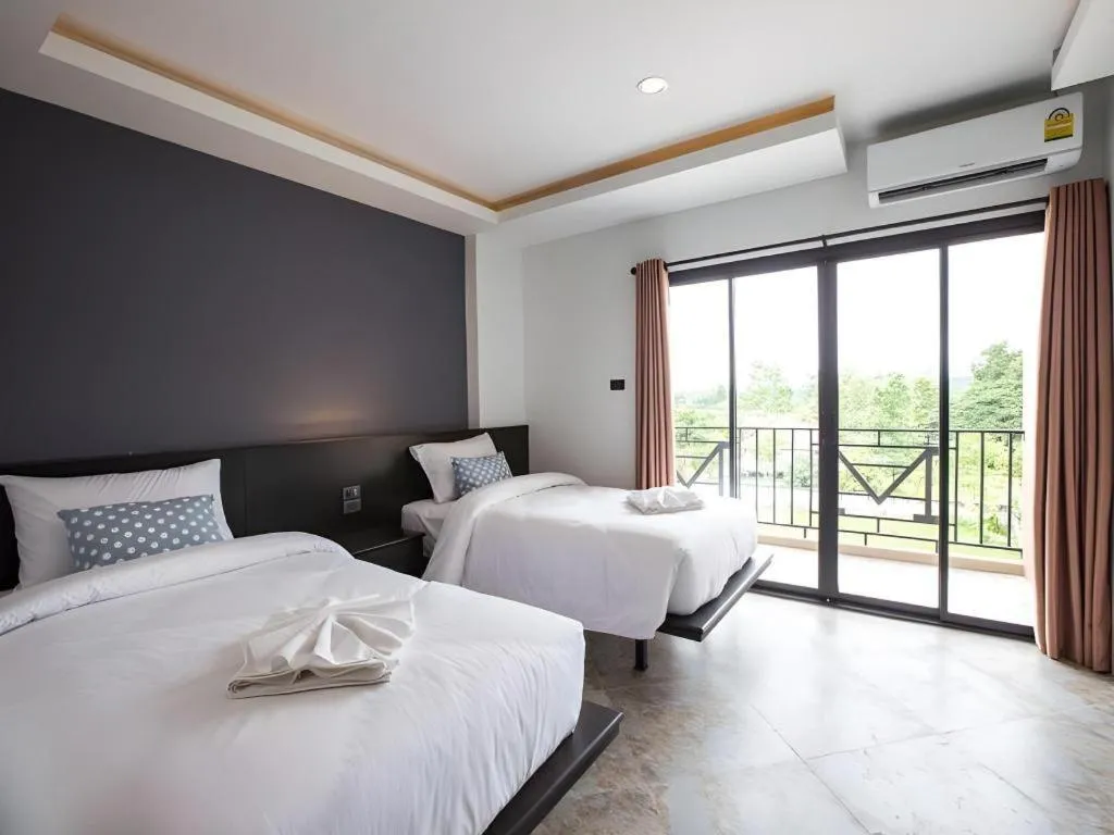 Bed in M Boutique Resort