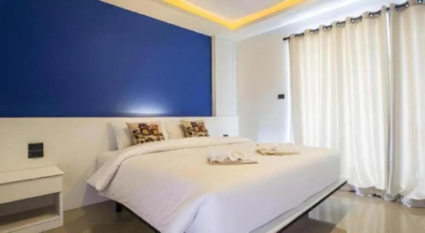 Bed in M Boutique Resort