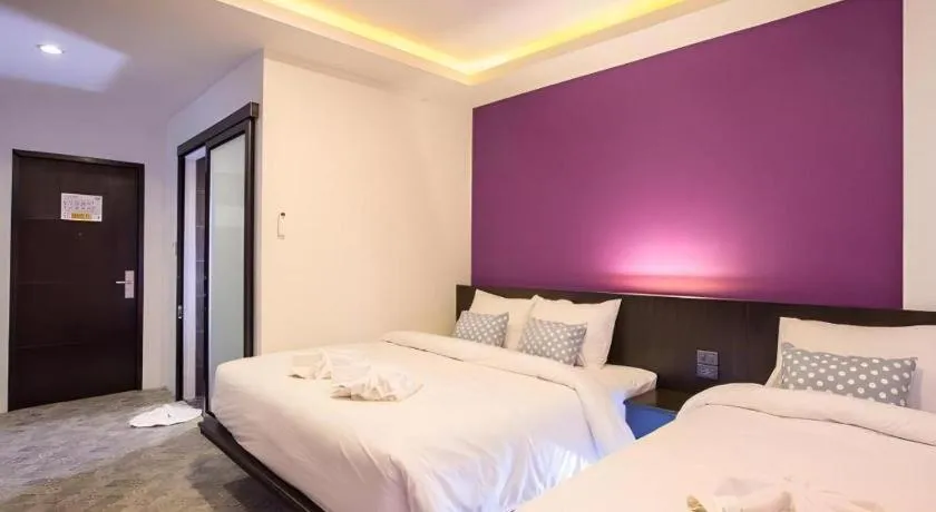 Bed in M Boutique Resort