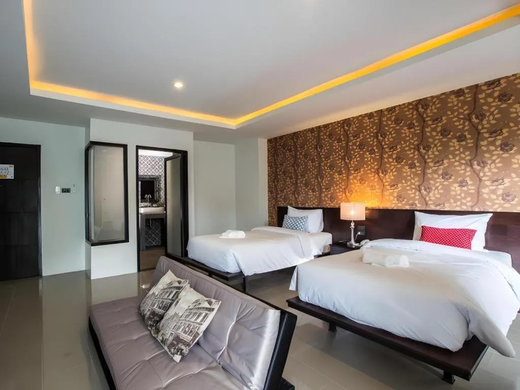 Bed in M Boutique Resort