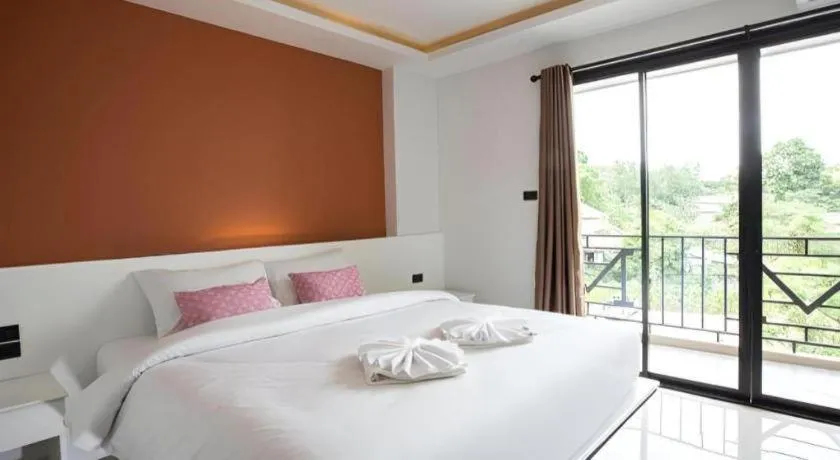 Bed in M Boutique Resort