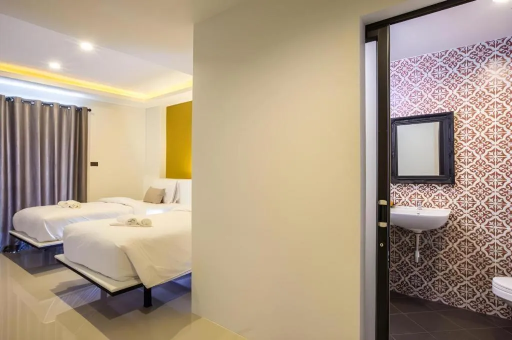 Bed in M Boutique Resort