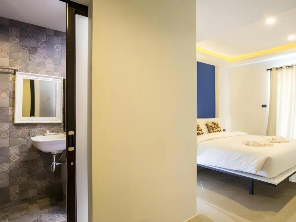 Bed in M Boutique Resort