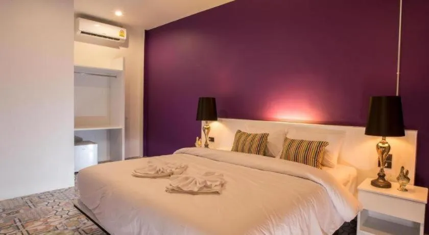 Bed in M Boutique Resort