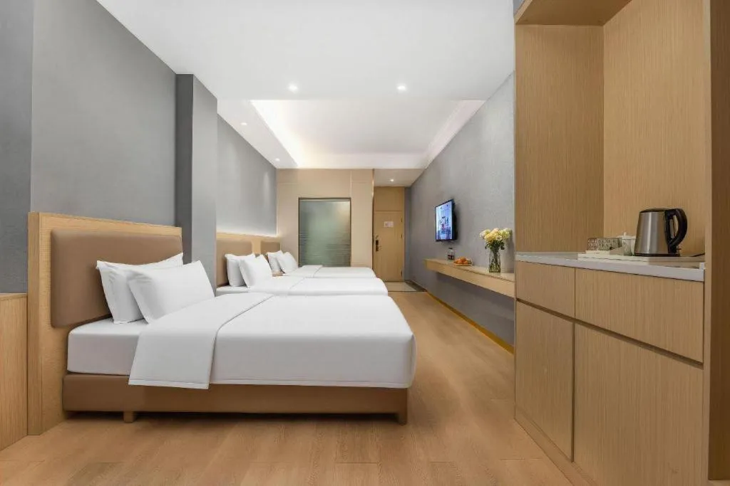 Bed in Vienna Hotel Nanning Train Station