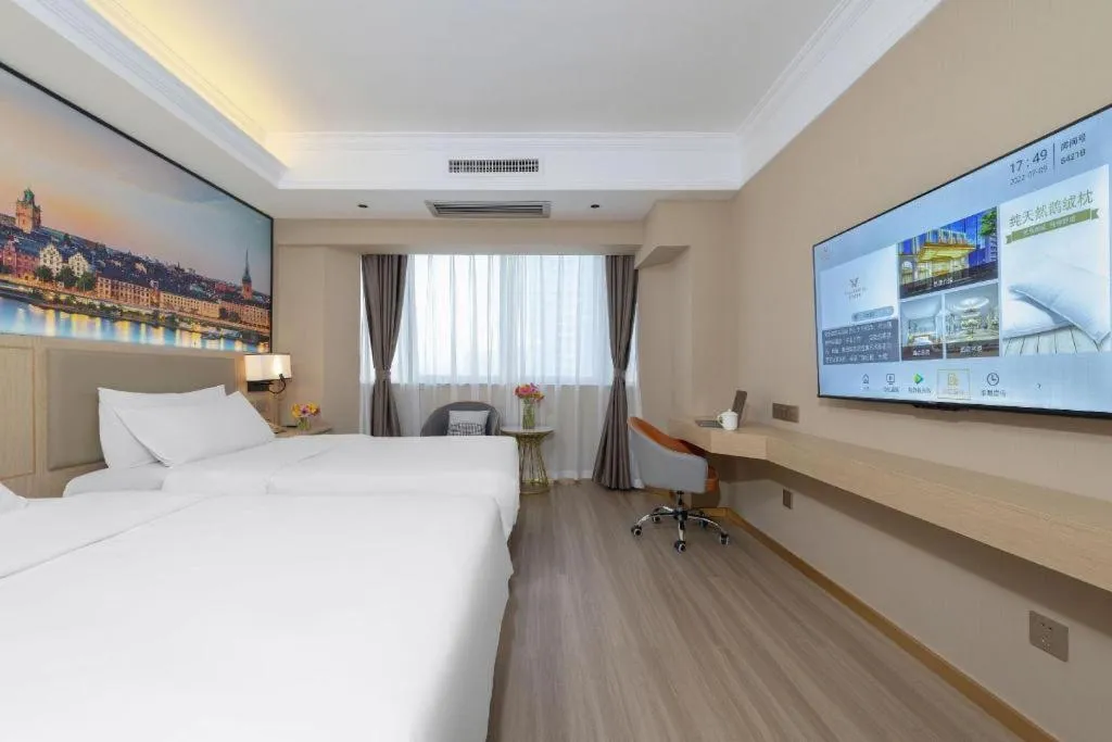 Bed in Vienna Hotel Nanning Train Station