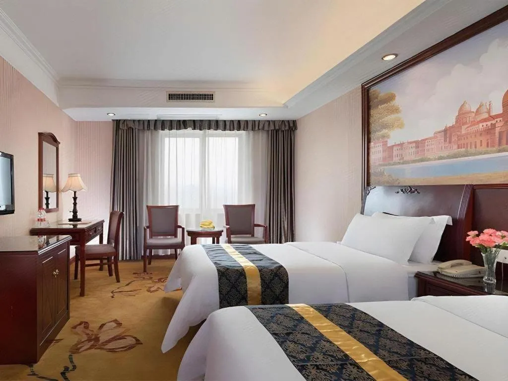 Bed in Vienna Hotel Nanning Train Station