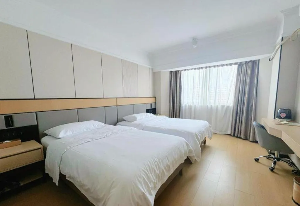 Bed in Vienna Hotel Nanning Train Station