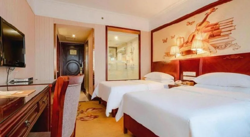 Bed in Vienna Hotel Nanning Train Station