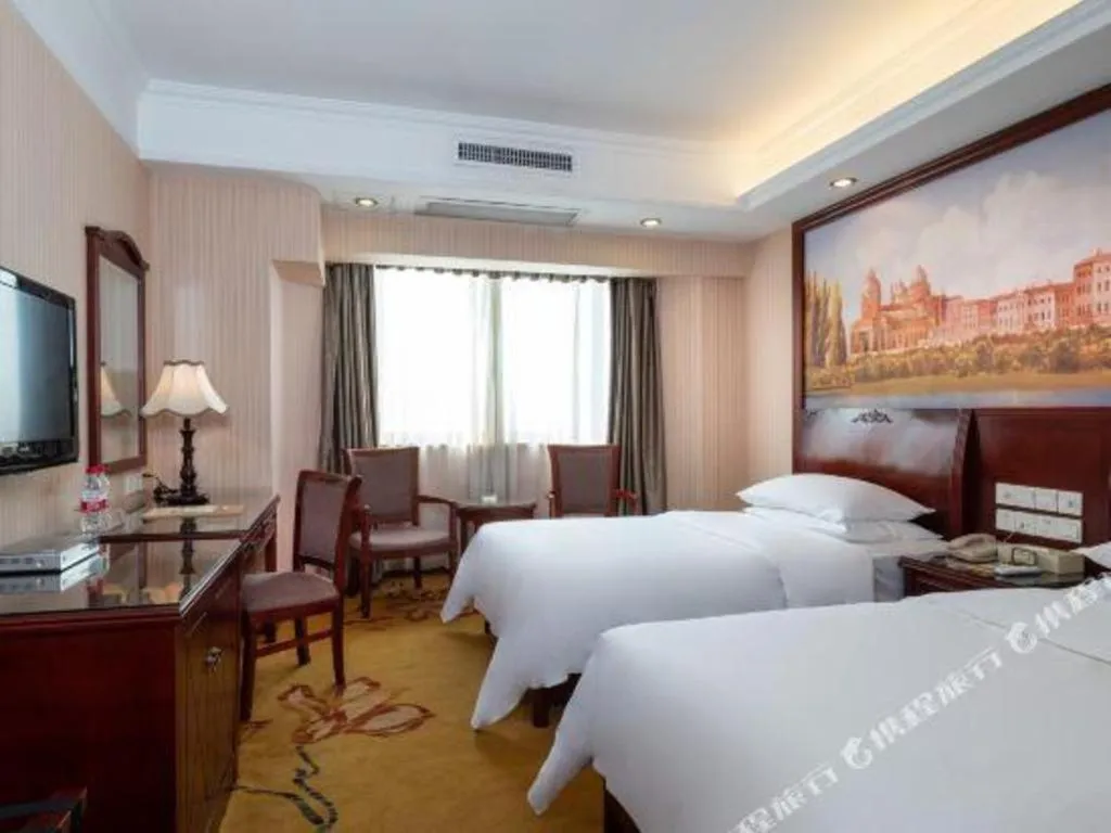 Bed in Vienna Hotel Nanning Train Station