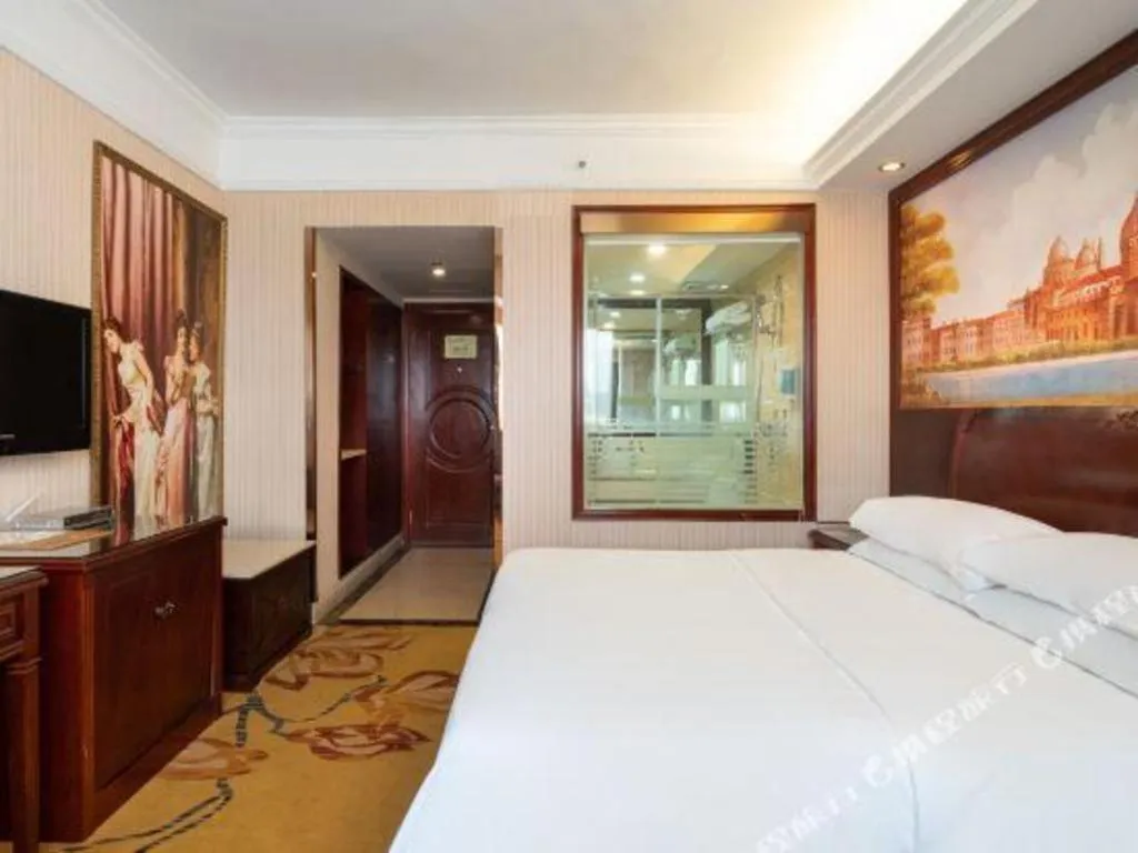 Bed in Vienna Hotel Nanning Train Station