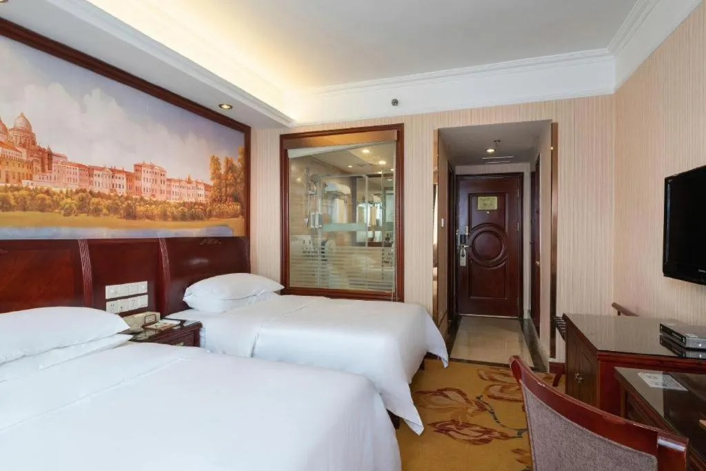 Bed in Vienna Hotel Nanning Train Station