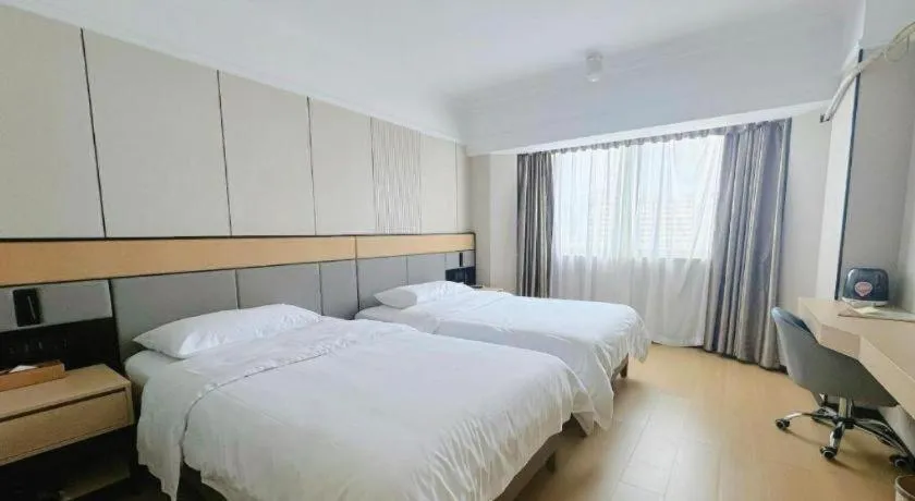 Bed in Vienna Hotel Nanning Train Station