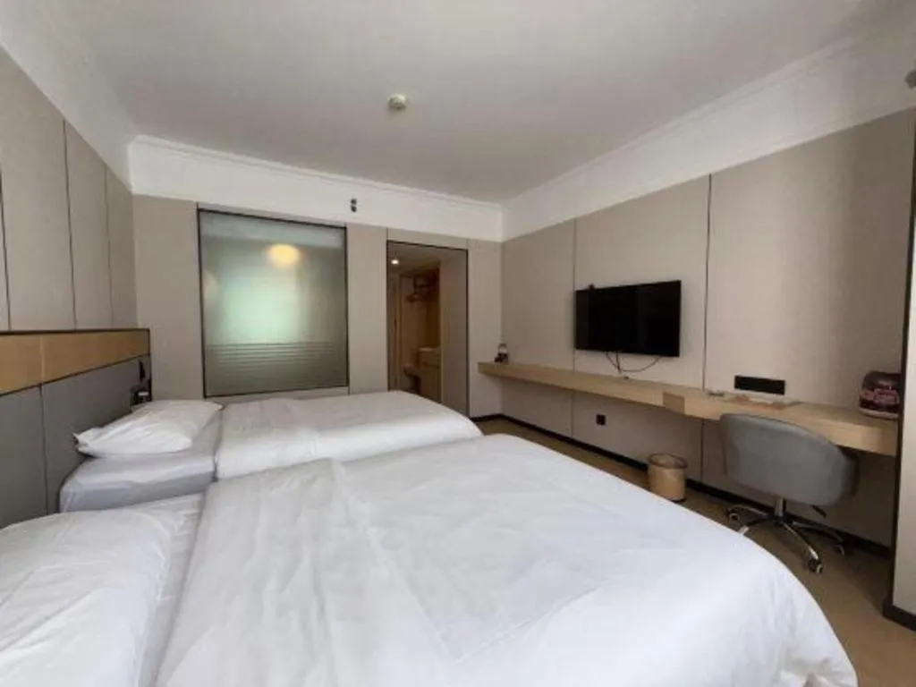 Bed in Vienna Hotel Nanning Train Station