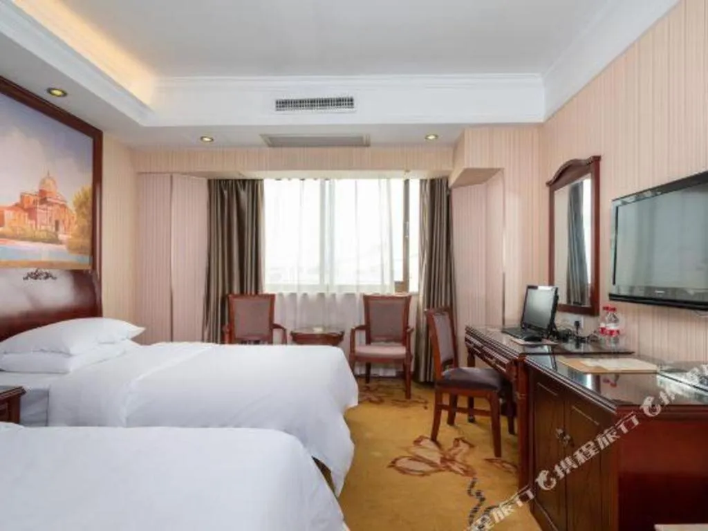 Bed in Vienna Hotel Nanning Train Station