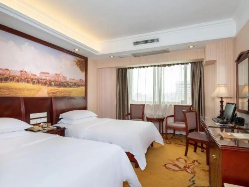 Bed in Vienna Hotel Nanning Train Station