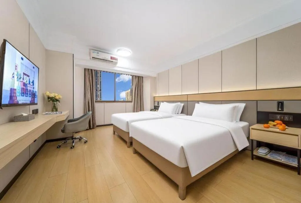 Bed in Vienna Hotel Nanning Train Station