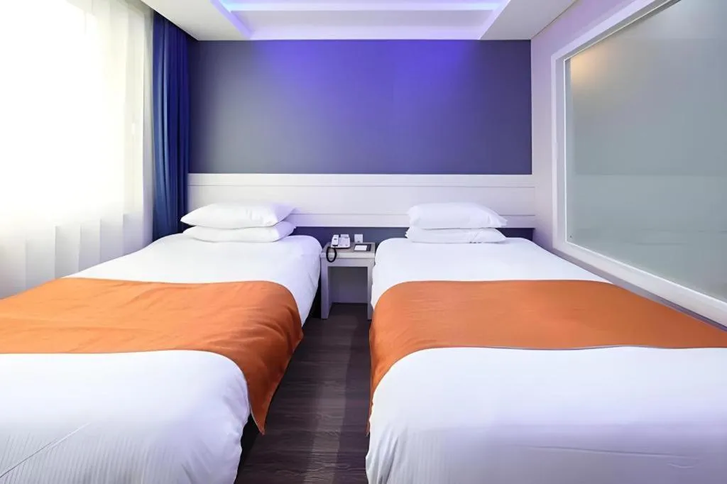 Bed in Galaxy Hotel