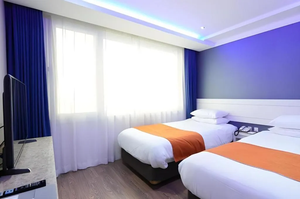 Bed in Galaxy Hotel